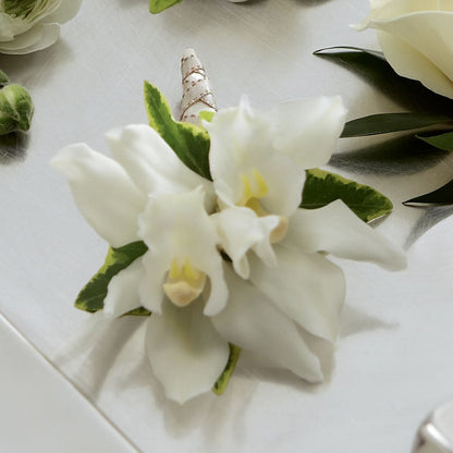 White Mini Cymbidium Boutonniere – SADIE'S FLOWER SHOP, Rayne LA